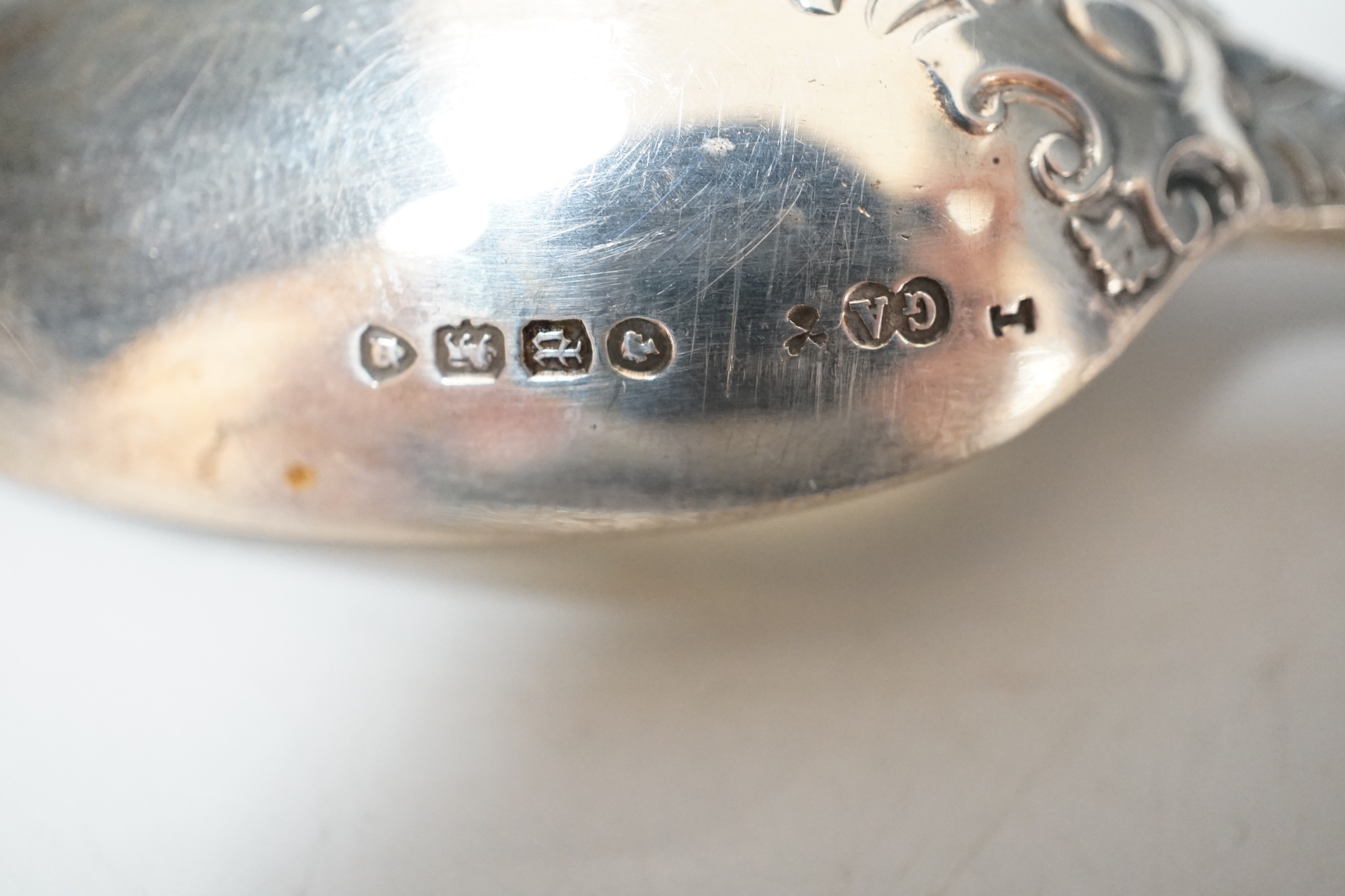 A George V silver christening mug, a cased Victorian silver christening spoon by George Adams and a plated christening mug.